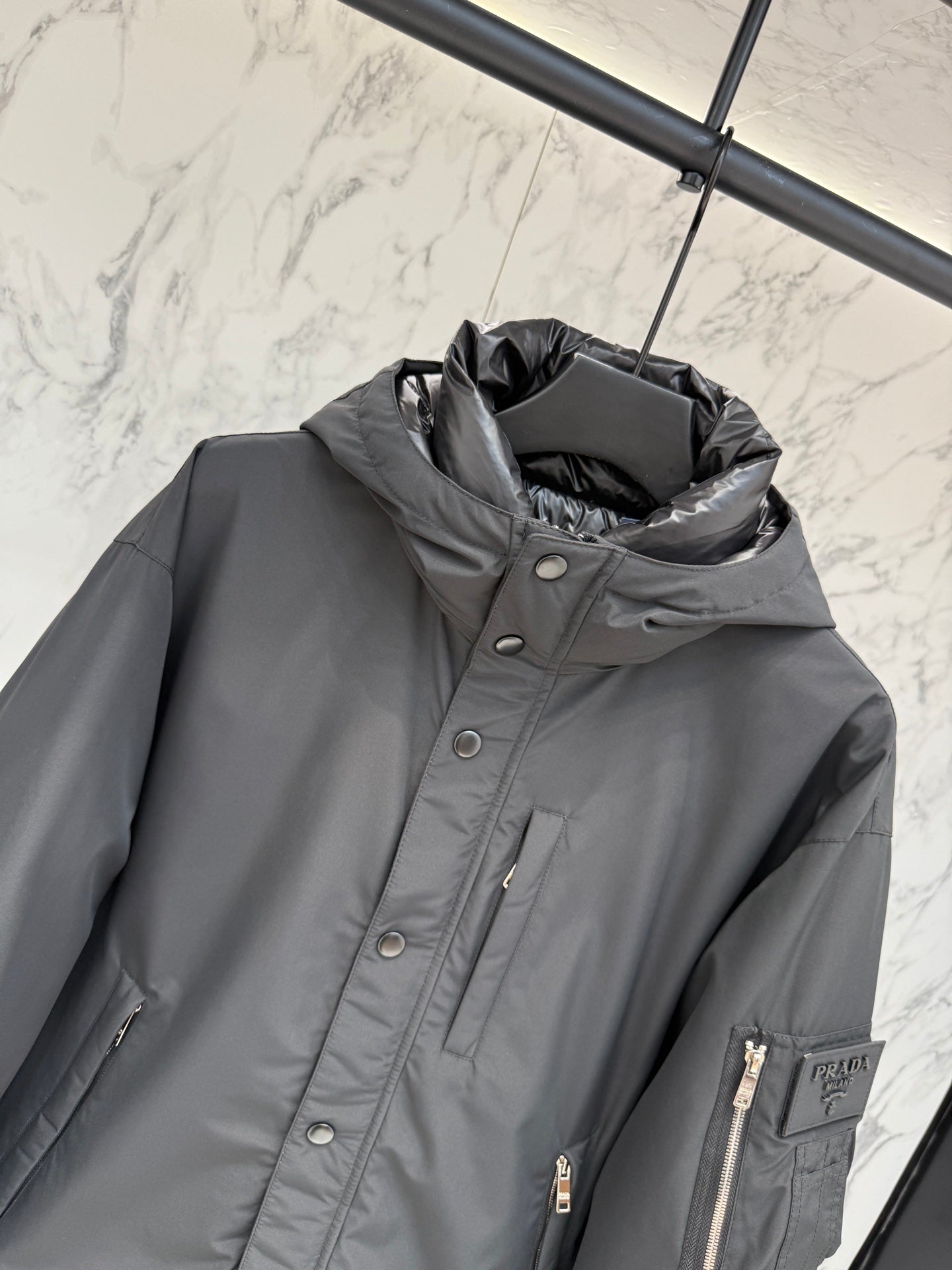 Pre-Owned Prada Nylon Down Jacket – Luxury Hooded Puffer with Metal Logo, Classic Black, Like New