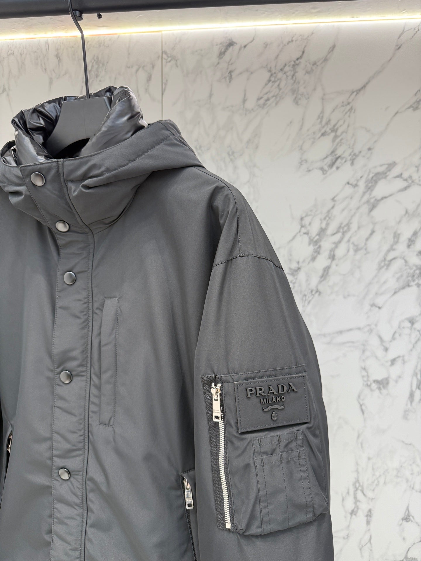 Pre-Owned Prada Nylon Down Jacket – Luxury Hooded Puffer with Metal Logo, Classic Black, Like New
