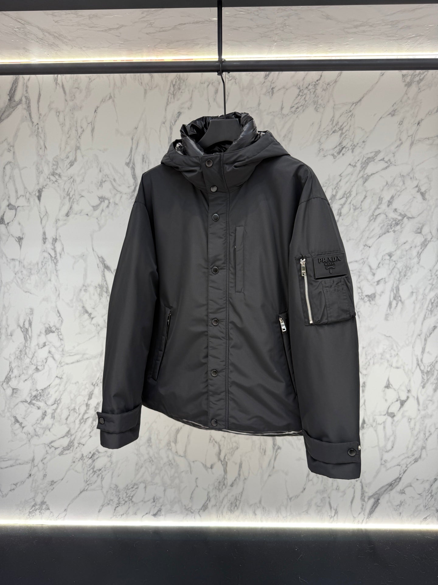 Pre-Owned Prada Nylon Down Jacket – Luxury Hooded Puffer with Metal Logo, Classic Black, Like New